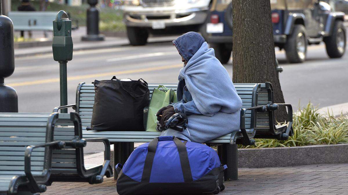 Benches on North Tryon are part of the homeless population's turf due to the lack of affordable housing.