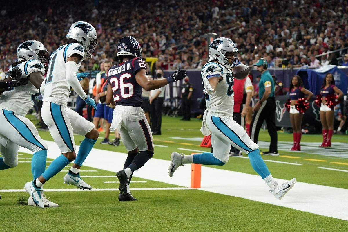 Carolina Panthers rookie tight end Tommy Tremble (82) rushes for a 7-yard touchdown as Houston Texans cornerback Vernon Hargreaves III (26) defends during the second half of an NFL football game Thursday, Sept. 23, 2021, in Houston. Carolina won, 24-9. It was the first time Tremble had ever touched the ball in an NFL game.