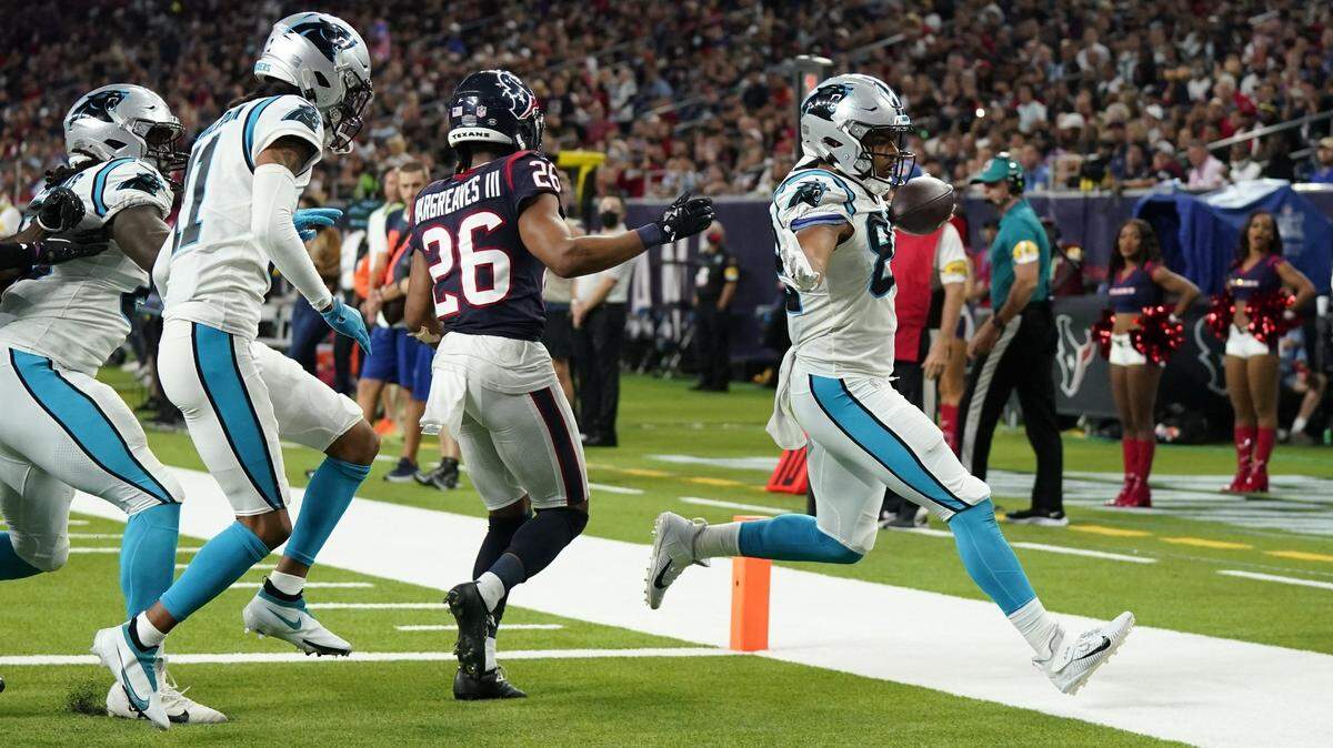 Carolina Panthers rookie tight end Tommy Tremble (82) rushes for a 7-yard touchdown as Houston Texans cornerback Vernon Hargreaves III (26) defends during the second half of an NFL football game Thursday, Sept. 23, 2021, in Houston. Carolina won, 24-9. It was the first time Tremble had ever touched the ball in an NFL game.