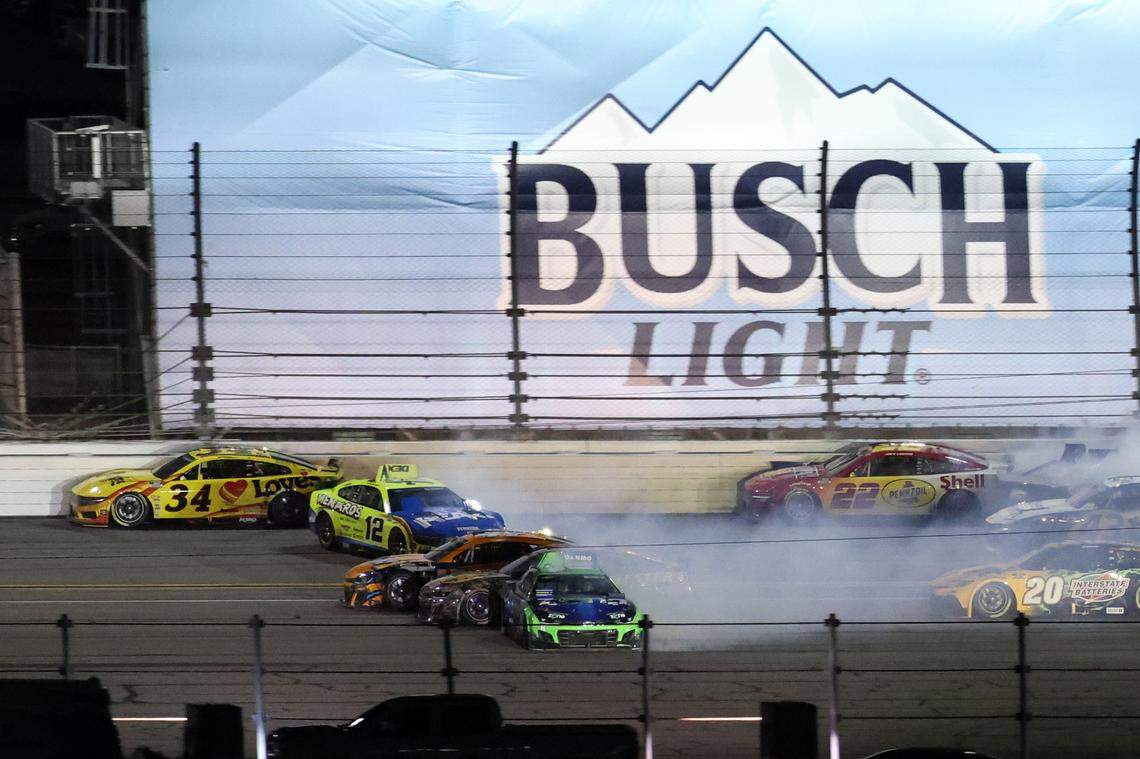 NASCAR Cup Series driver Ryan Blaney (12) and driver Kyle Busch (8) wreck on the back stretch during the Daytona 500 at Daytona International Speedway. Mark J. Rebilas-Imagn Images
