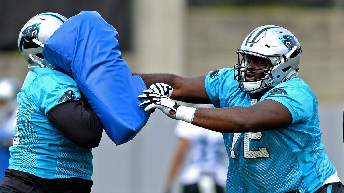 After playing sparsely as a rookie, Carolina Panthers offensive lineman Taylor Moton, right, could become a starter at guard with the departure in free agency of Andrew Norwell.