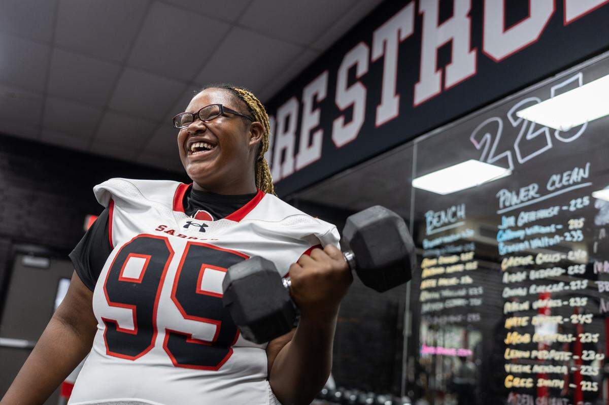 South Mecklenburg's female offensive lineman, Yazmine Beverly, poses for a portrait at her high school in Charlotte. 