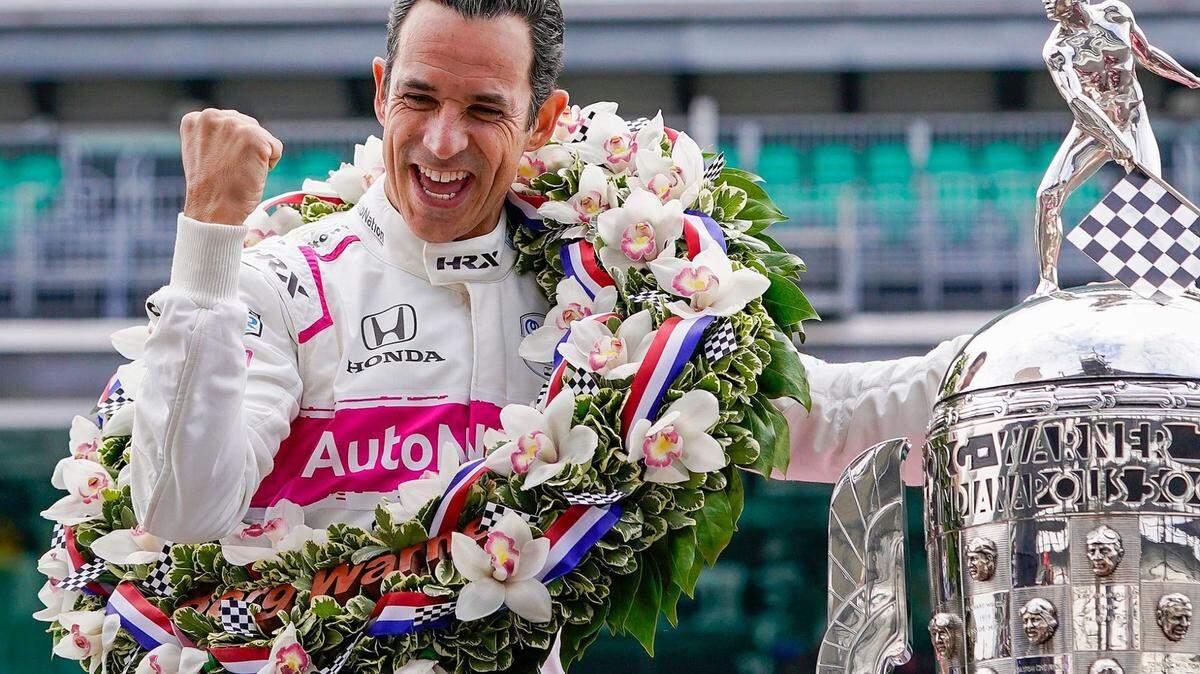Helio Castroneves, who will run in the 2025 NASCAR Daytona 500, celebrates winning the 105th Indianapolis 500 on May 31, 2021, tying the record for most wins in Indy 500 history.