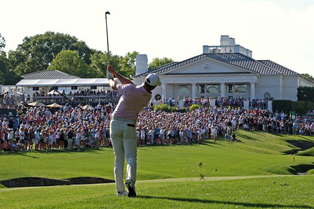 Rory McIlroy follows through on his swing to the 18th green in 2024 at Quail Hollow Club. McIlroy has won the event four times.