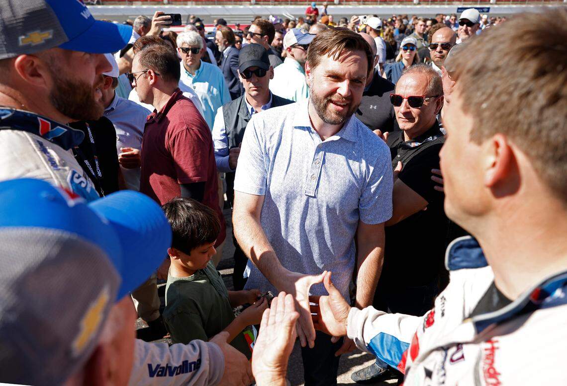 Vice Presidential Nominee Senator JD Vance, center, shakes hands with crewmen along pit road at Charlotte Motor Speedway prior to the running of the Bank of America Roval 400 on Sunday, October 13, 2024 in Concord, NC.