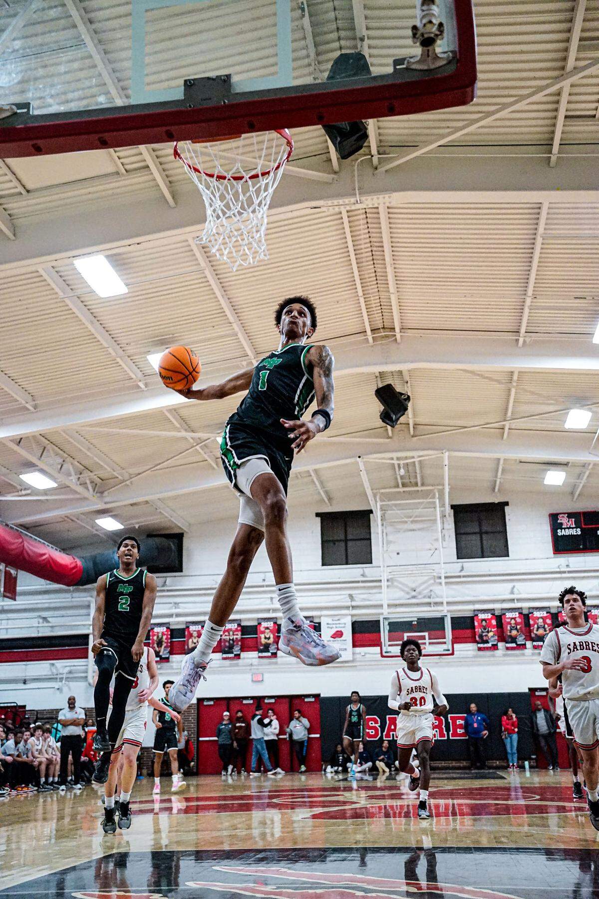 Title: Dunk at the sabres house Sadiq White dunking against rival school SouthMeck, January 19th 2024