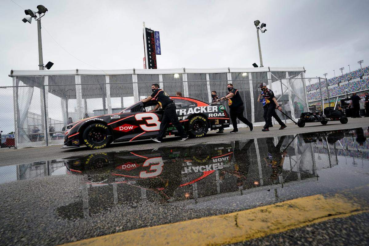 The car driven by Austin Dillon is pushed to the inspection area before the NASCAR Daytona 500 auto race at Daytona International Speedway, Sunday, Feb. 14, 2021, in Daytona Beach, Fla. (AP Photo/John Raoux)
