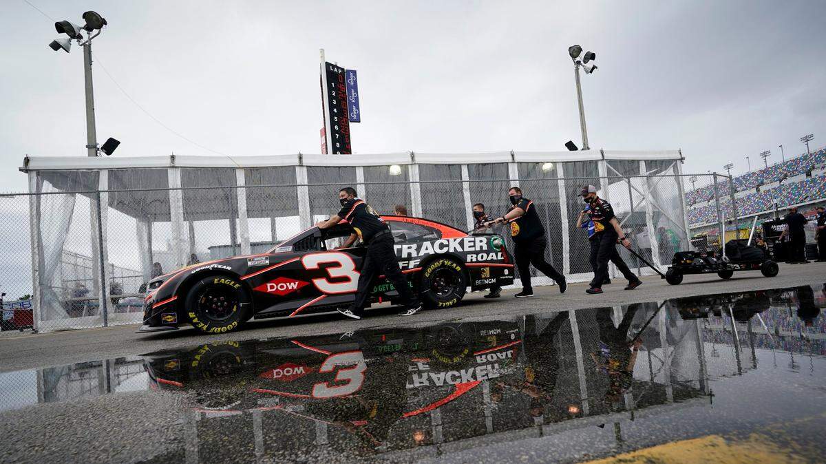 The car driven by Austin Dillon is pushed to the inspection area before the NASCAR Daytona 500 auto race at Daytona International Speedway, Sunday, Feb. 14, 2021, in Daytona Beach, Fla. (AP Photo/John Raoux)