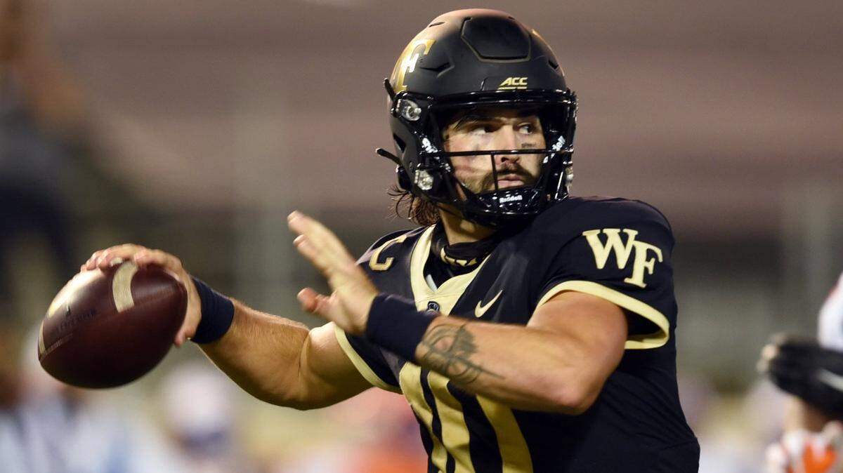 Wake Forest quarterback Sam Hartman drops back to throw in an NCAA college football game against Clemson, Saturday, Sept. 12, 2020 at Truist Field in Winston-Salem, N.C. (Walt Unks/Winston-Salem Journal)
