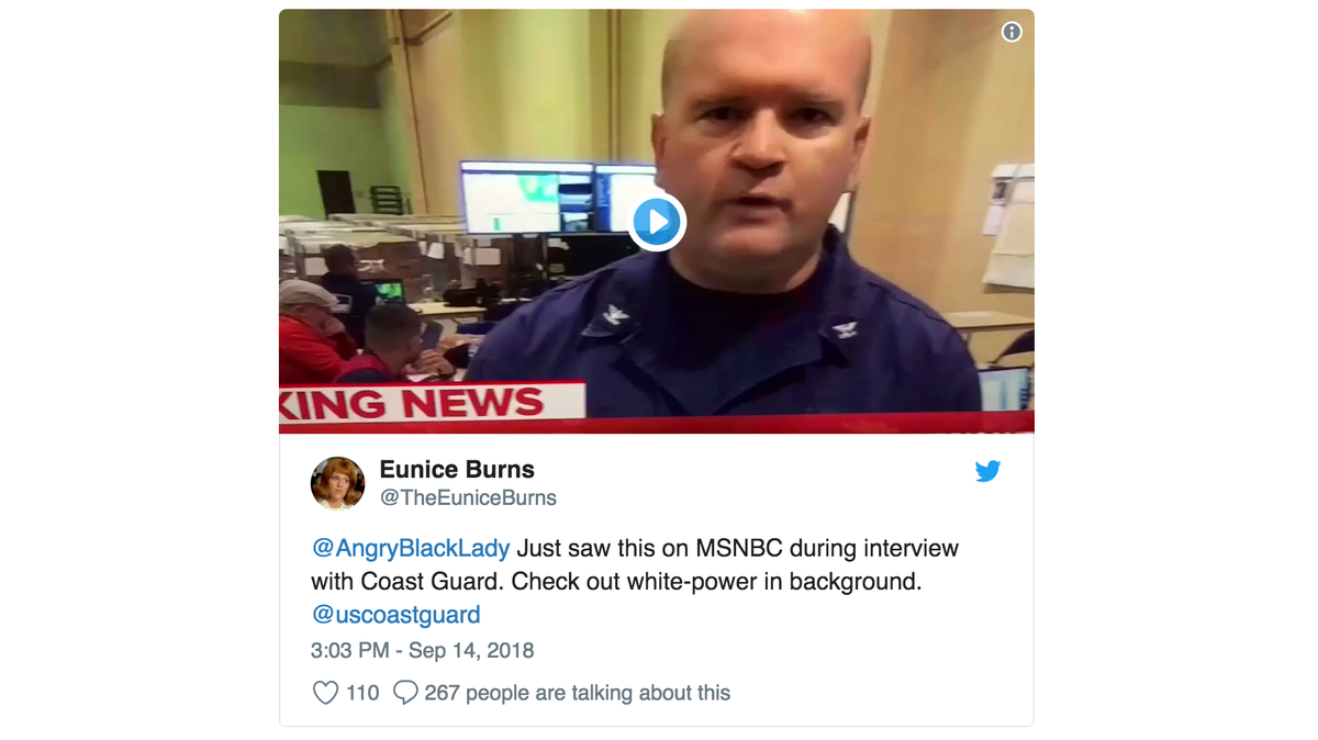 In the background of a Coast Guard briefing on MSNBC on Friday evening, in a bustling aid center, a Coast Guard member flashed what some TV viewers say was a white power sign at the camera.