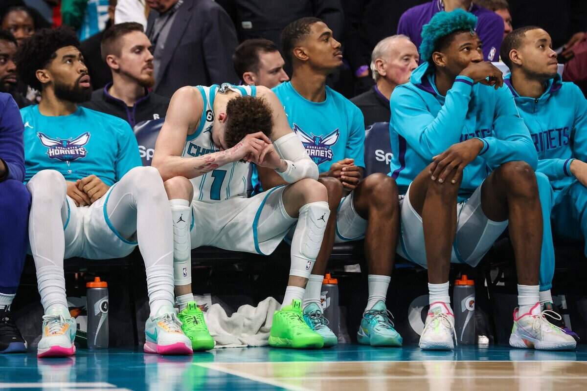 Hornets guard LaMelo Ball hangs his head on the bench after fouling out of the game against the Pistons at Spectrum Center on Wednesday, December 14, 2022. The Hornets lost to the Pistons in overtime, 141-134.