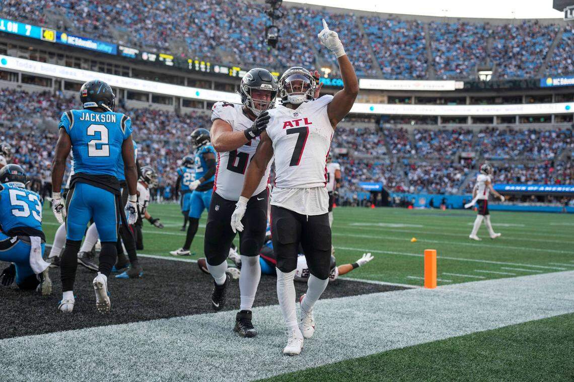 Oct 13, 2024; Charlotte, North Carolina, USA; Atlanta Falcons running back Bijan Robinson (7) reacts to his touchdown against the Carolina Panthers during the second quarter at Bank of America Stadium. Mandatory Credit: Jim Dedmon-Imagn Images