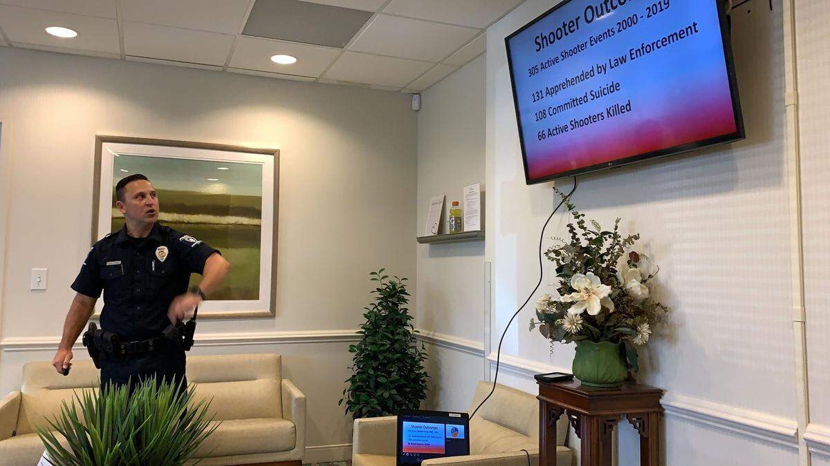 In this undated photo provided by Charlotte-Mecklenburg Police, Officer Jonathan Frisk conducts an active shooter training that’s available to businesses, churches and other organizations. It’s free, but Frisk says CMPD is booked through August 2022.
