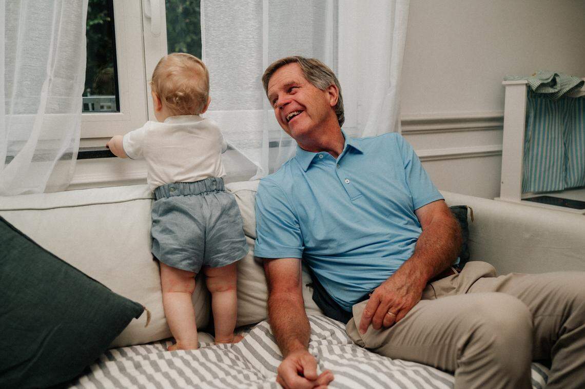 Scott Davenport with his 1-year-old grandchild, George, in 2024.