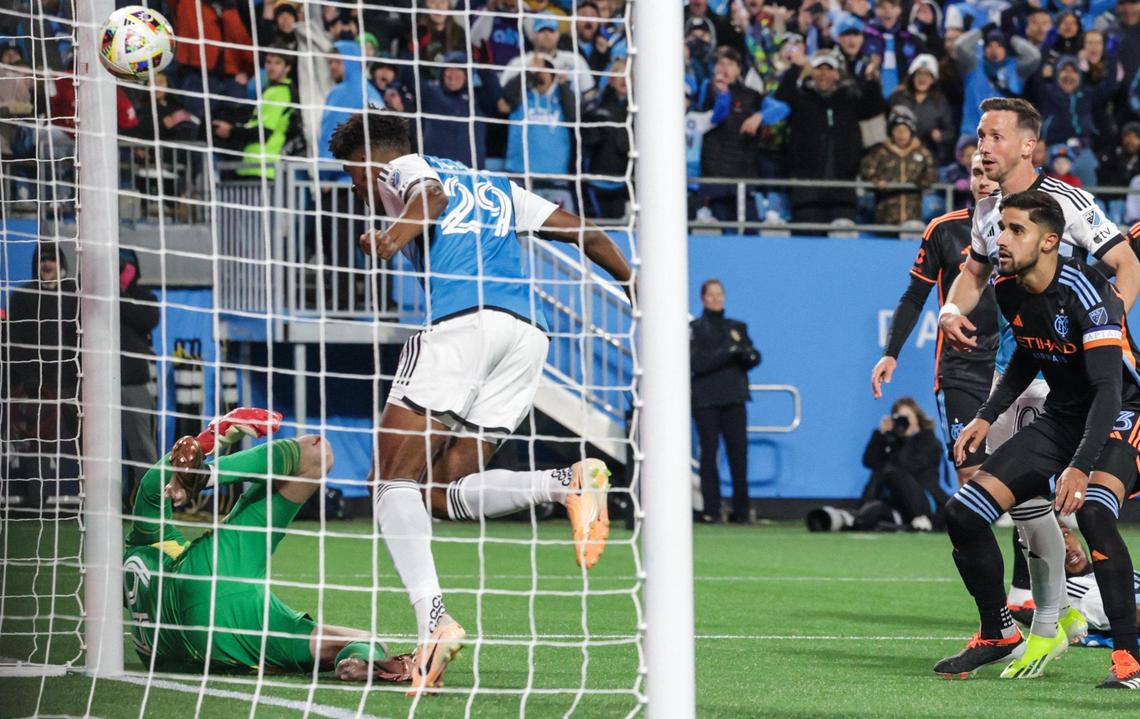Charlotte FC’s Adilson Malanda, second from left, goes for a header to score a goal against New York City FC during the home opener at Bank of America Stadium in Charlotte, NC on February 24, 2024.