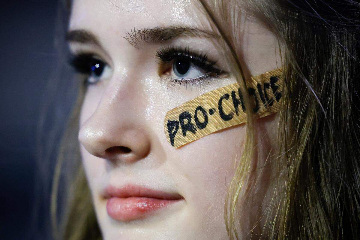 McCaul Border, 16, of Charlotte, and her mother, not pictured, joined other pro abortion rights activists in front of the Charlotte-Mecklenburg Government Center in Charlotte, June 26, 2022. The demonstration was in response to the U.S. Supreme Court’s decision to overturn Roe v. Wade.