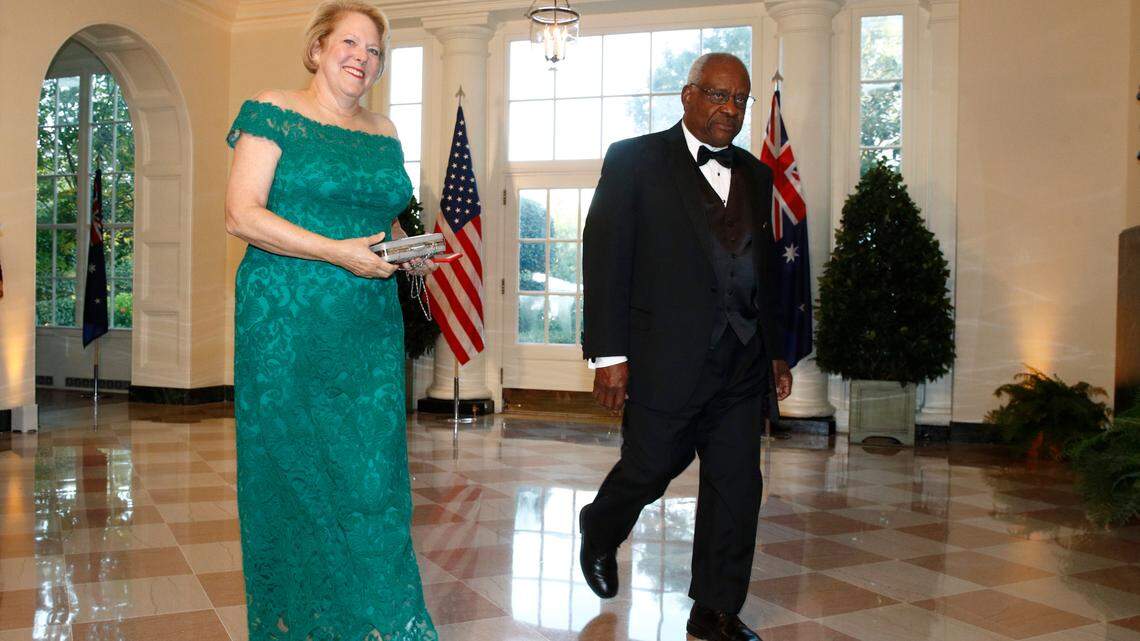 FILE - Supreme Court Associate Justice Clarence Thomas, right, and wife Virginia “Ginni” Thomas arrive for a State Dinner at the White House in Washington on Sept. 20, 2019.