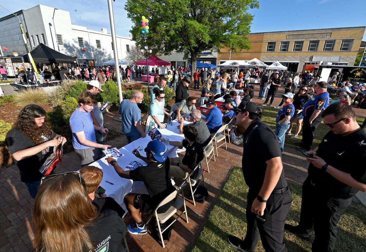 NASCAR fans line up to get the autographs of NASCAR XFINITY Series and Craftsman Truck Series drivers along with former stars Kenny Wallace and Ken Schrader during Thunder Fest in downtown Rockingham, NC on Thursday, April 17, 2025. Fans are celebrating the return of the NASCAR Craftsman Truck Series and XFINITY Series to Rockingham Speedway this weekend.