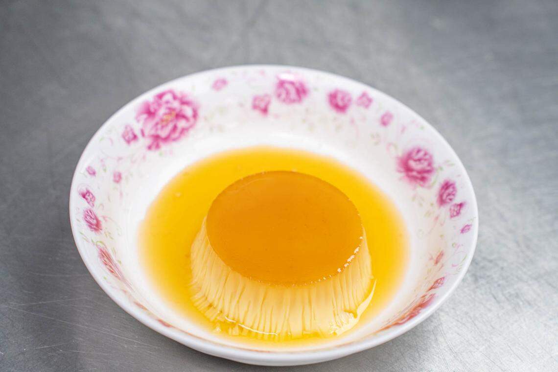 Chef Andres Kaifer’s flan at Customshop can be topped with a variety of garnishes, such as fruit.