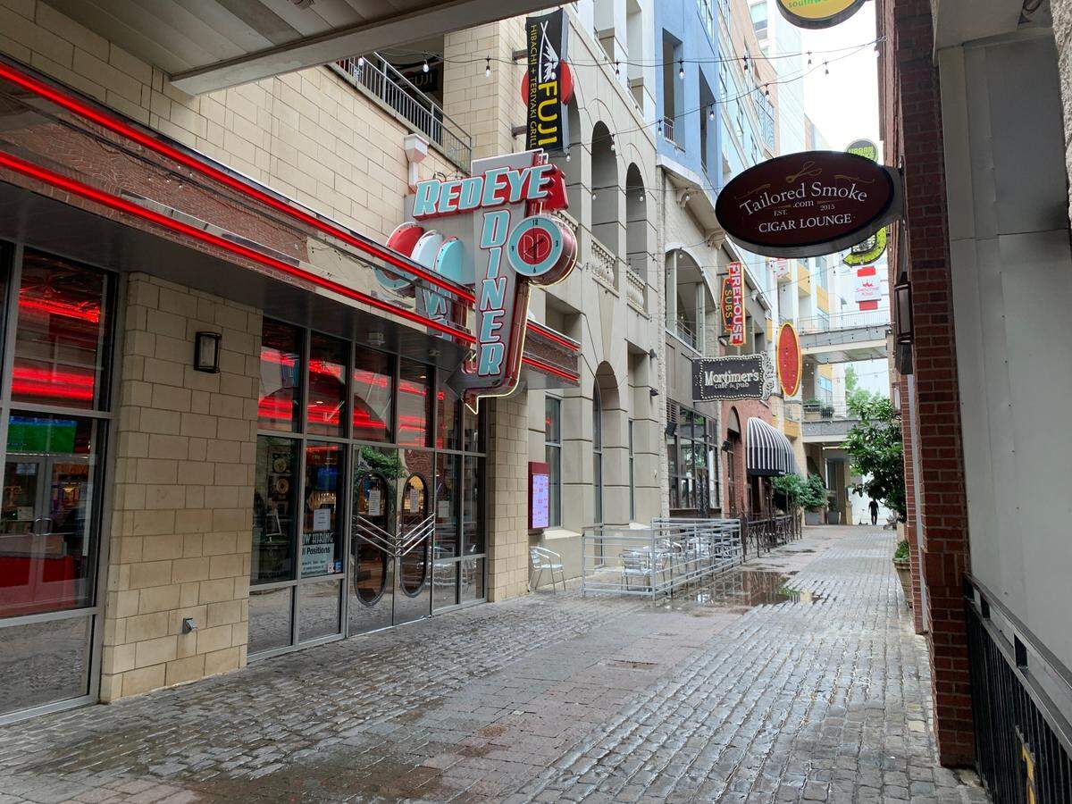 The bright red neon lights of Redeye Diner stand out in the Epicentre shopping center.