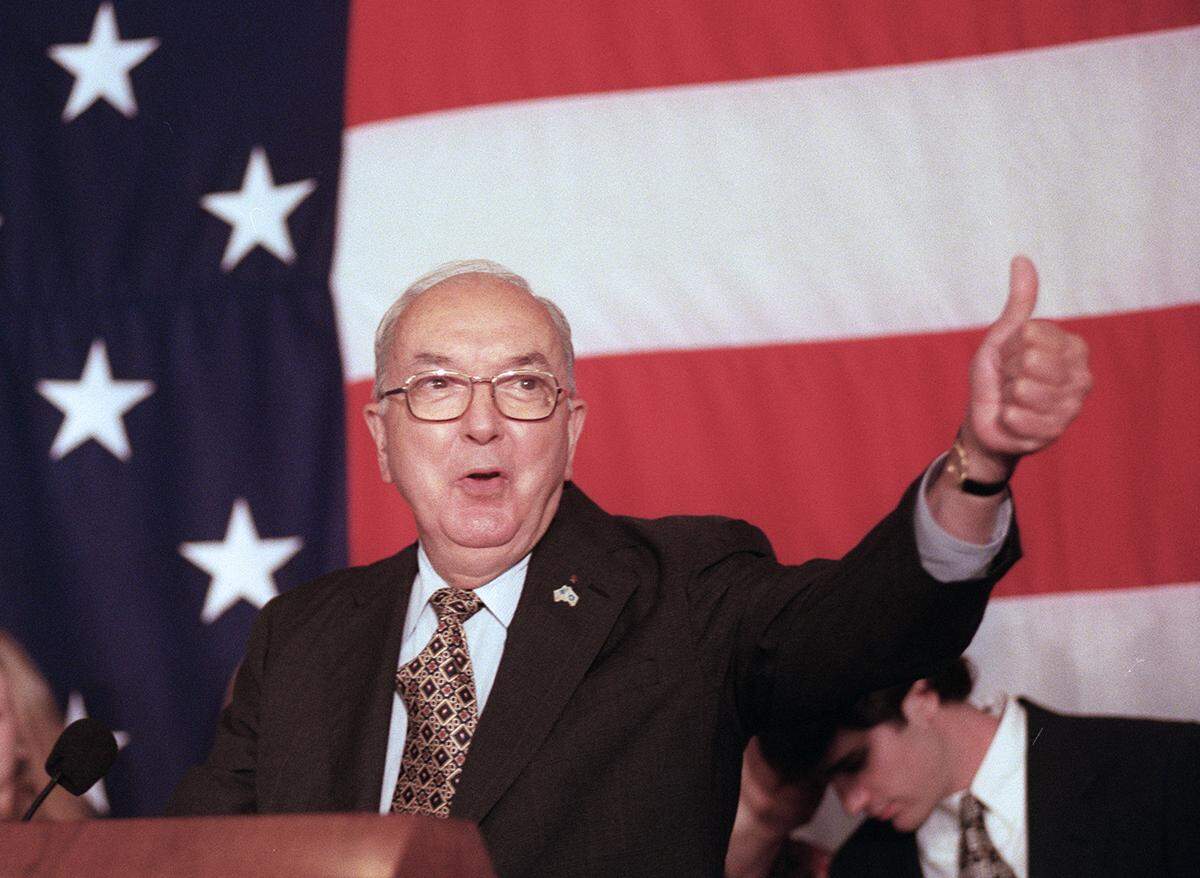 Sen. Jesse Helms gives the thumbs up to supporters at in 1996.