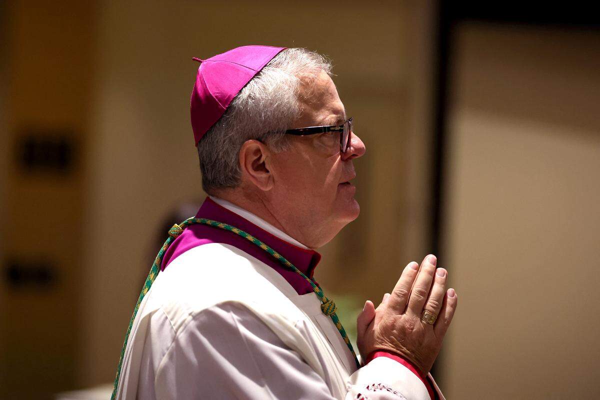 Bishop Michael Martin waits to follow the processional into the sanctuary of St. Gabriel Catholic Church for the funeral of H.A. “Humpy” Wheeler Jr., the former Charlotte Motor Speedway president on Tuesday, August 26, 2025. 