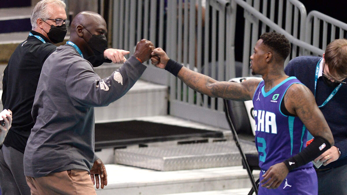 Charlotte Hornets owner Michael Jordan bumps fists with guard Terry Rozier after Rozier’s clutch performance to beat the Detroit Pistons last season.