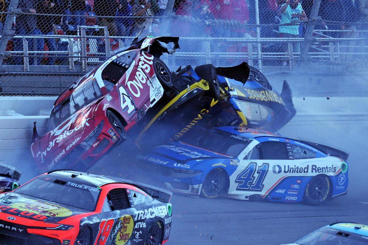 Apr 21, 2024; Talladega, Alabama, USA; NASCAR Cup Series driver Josh Berry (4), NASCAR Cup Series driver Corey LaJoie (7) and NASCAR Cup Series driver Ryan Preece (41) wreck on the last lap during the GEICO 500 at Talladega Superspeedway.