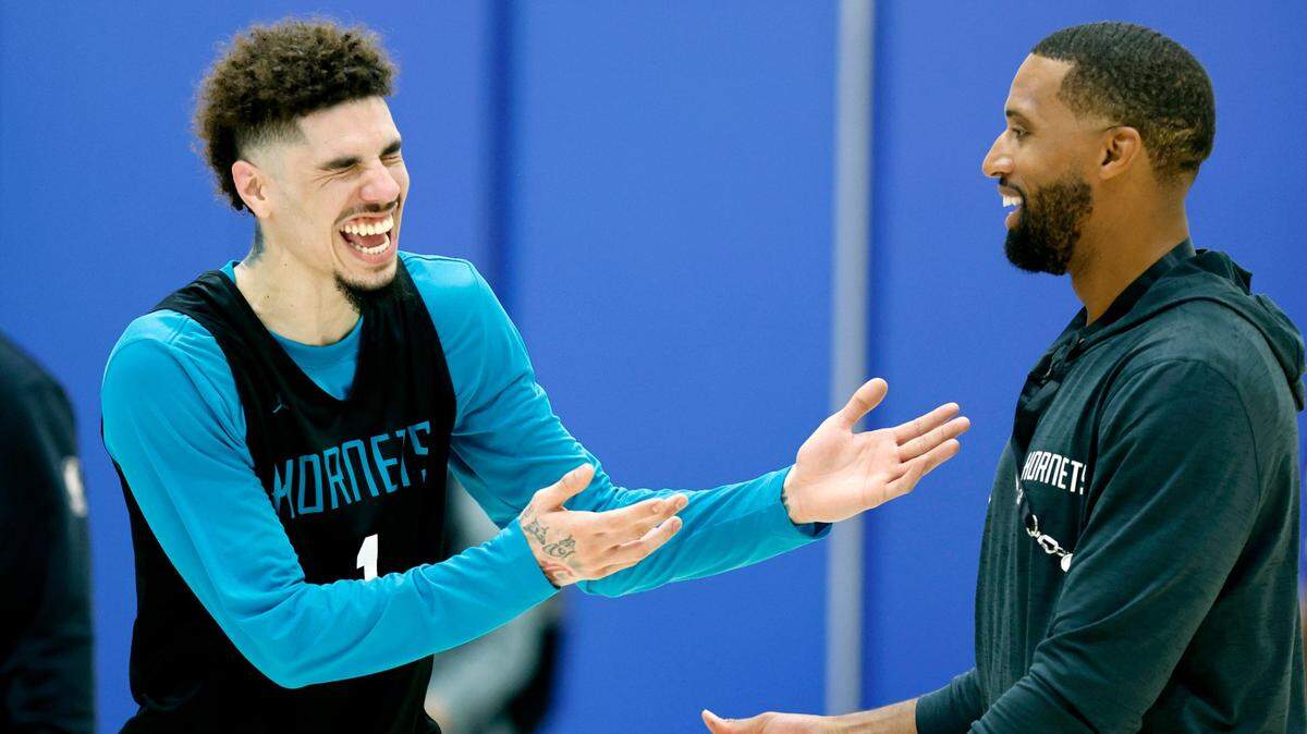 Charlotte Hornets’ LaMelo Ball (1) laughs with head coach Charles Lee after Charlotte’s practice at the Michael W. Krzyzewski Center at Duke University in Durham, N.C., Tuesday, Oct. 1, 2024.