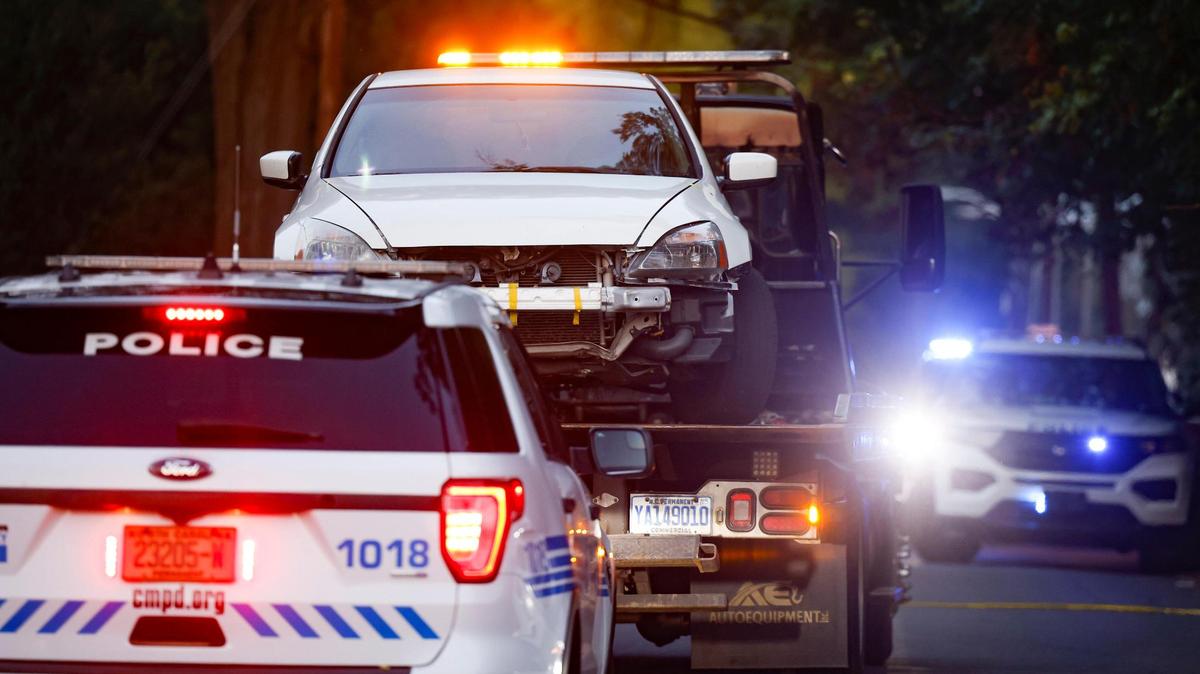 A white Honda Accord is removed from the scene where officers fired on an armed person on Onyx Street in Charlotte, N.C., on Thursday, Sept. 15, 2022.
