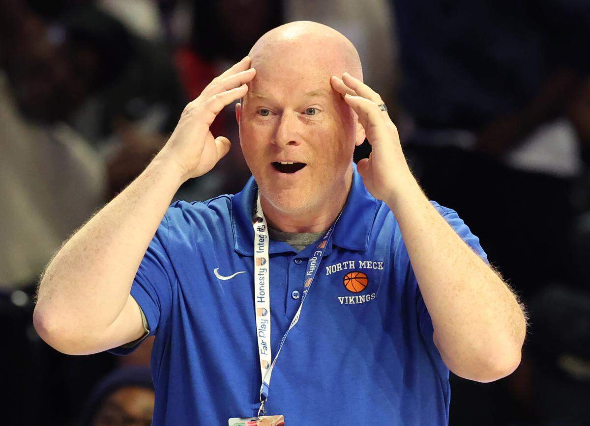 North Meck head coach Duane Lewis reacts to an official’s call during action against New Hanover on Saturday, March 15, 2025. North Meck defeated New Hanover 59-56 in the boys NCHSAA 4A State Championship game at Lawrence Joel Veterans Coliseum in Winston-Salem, NC.