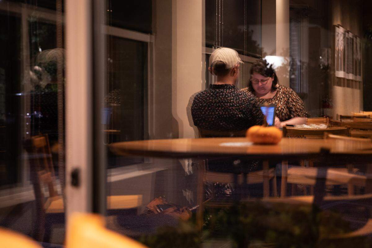 Trent Crumpler and Ashley McElroy of Something Fabulous Weddings & Events meet at Starbucks. Crumpler and McElroy stay organized through weekly business meetings and a shared, color-coordinated Google Calendar.