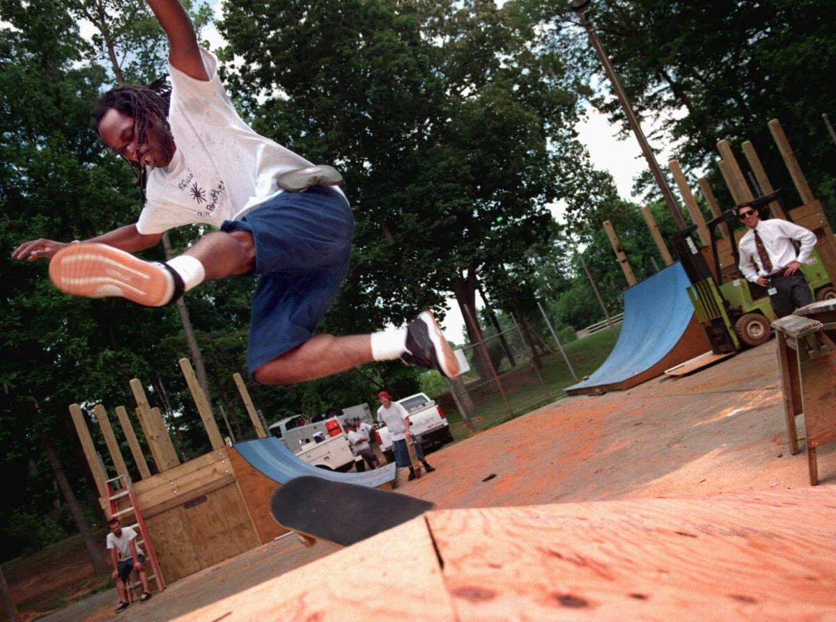 Ray Goff, shown in this Observer photo dated July 1996, jumps the pyramid at the nearly completed skateboard area at Methodist Home Park on Shamrock Drive in Charlotte.