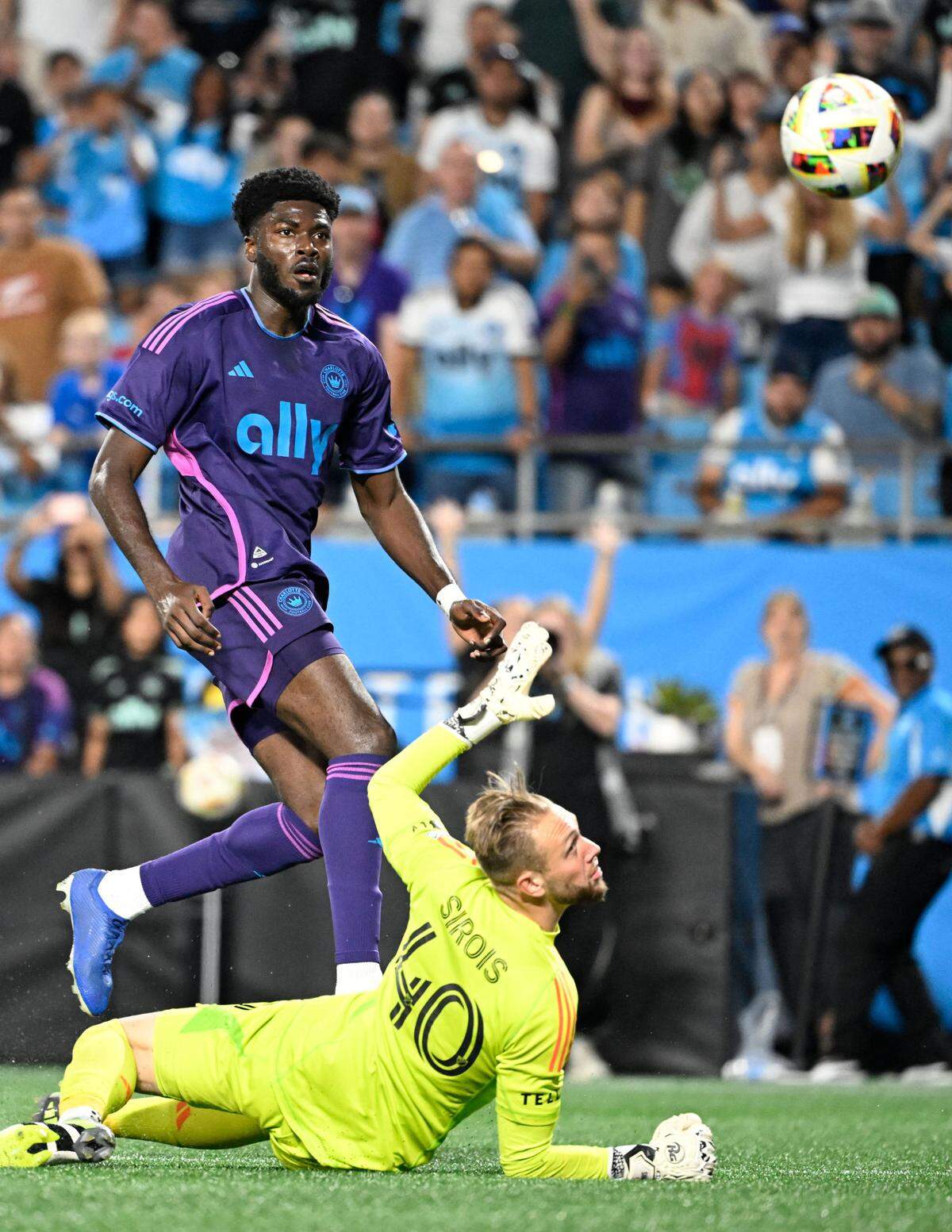 Charlotte FC forward Patrick Agyemang (33) scores as CF Montreal goalkeeper Jonathan Sirois (40) defends in the second half of Saturday’s match at Bank of America Stadium. Agyemang’s goal was the final one in Charlotte’s 2-0 win.