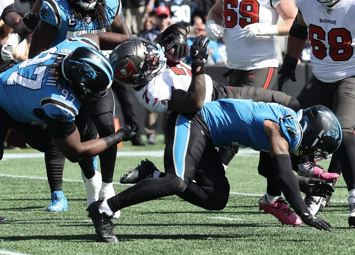 Tampa Bay Buccaneers running back Bucky Irving is tackled by Carolina Panthers defensive tackle Bobby Brown III during the game Sunday, Oct. 25, 2026 at Bank of America Stadium in Charlotte.