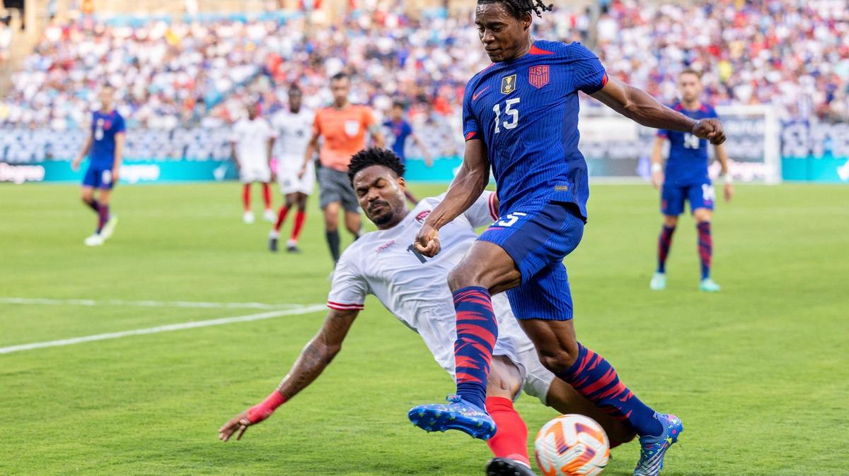 Team USA’s Dejuan Jones tries to maintain possession against Trinidad and Tobago’s Alvin Jones during a match at Bank of America Stadium on Sunday, July 2, 2023.