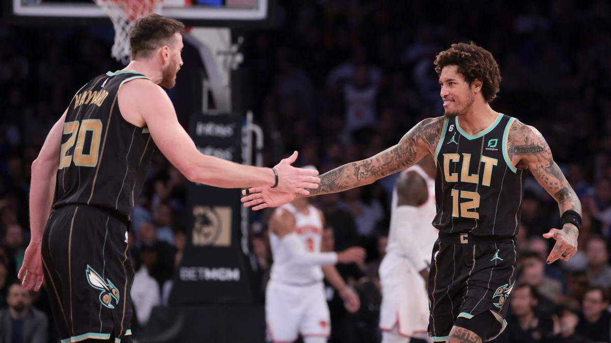 Mar 7, 2023; New York, New York, USA; Charlotte Hornets guard Kelly Oubre Jr. (12) celebrates with forward Gordon Hayward (20) after a basket against the New York Knicks during the second half at Madison Square Garden. Mandatory Credit: Vincent Carchietta-USA TODAY Sports