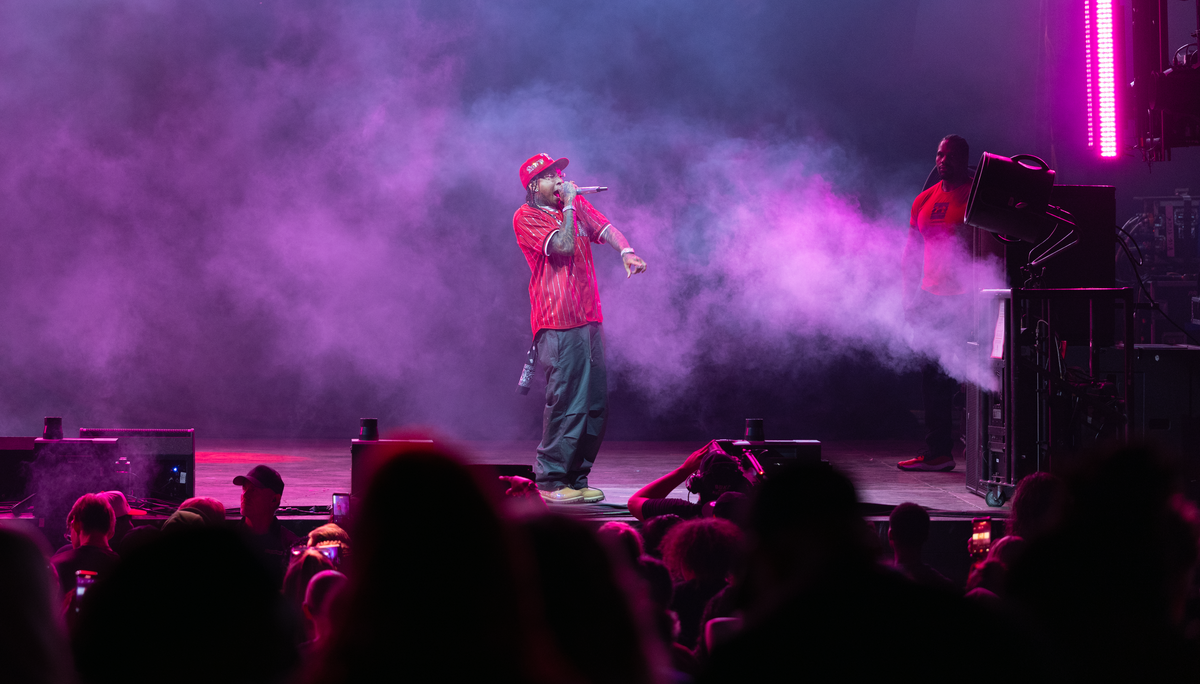 Tyga fires up the crowd during a set to open for Lil Wayne at PNC Music Pavilion in Charlotte on Thursday night.