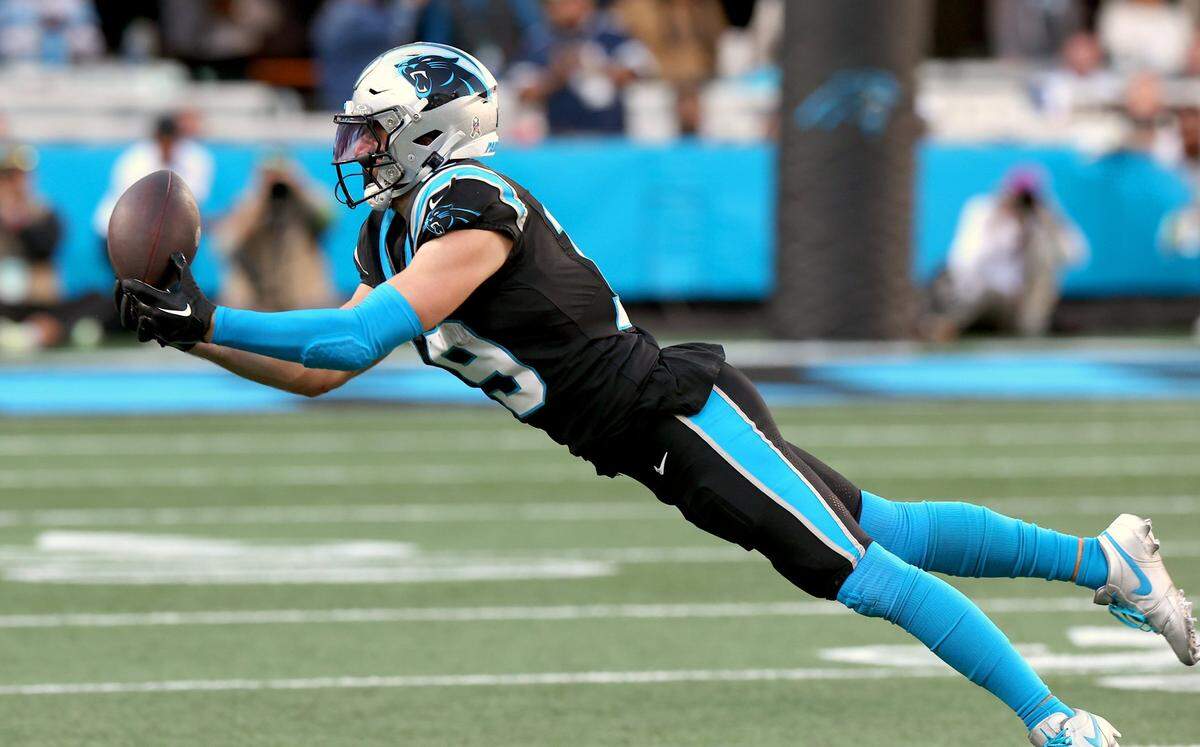 Carolina Panthers wide receiver Adam Thielen stretches out to catch a pass from quarterback Bryce Young during second half action against the Dallas Cowboys at Bank of America Stadium in Charlotte, NC on Sunday, November 19, 2023. The Cowboys defeated the Panthers 33-10.