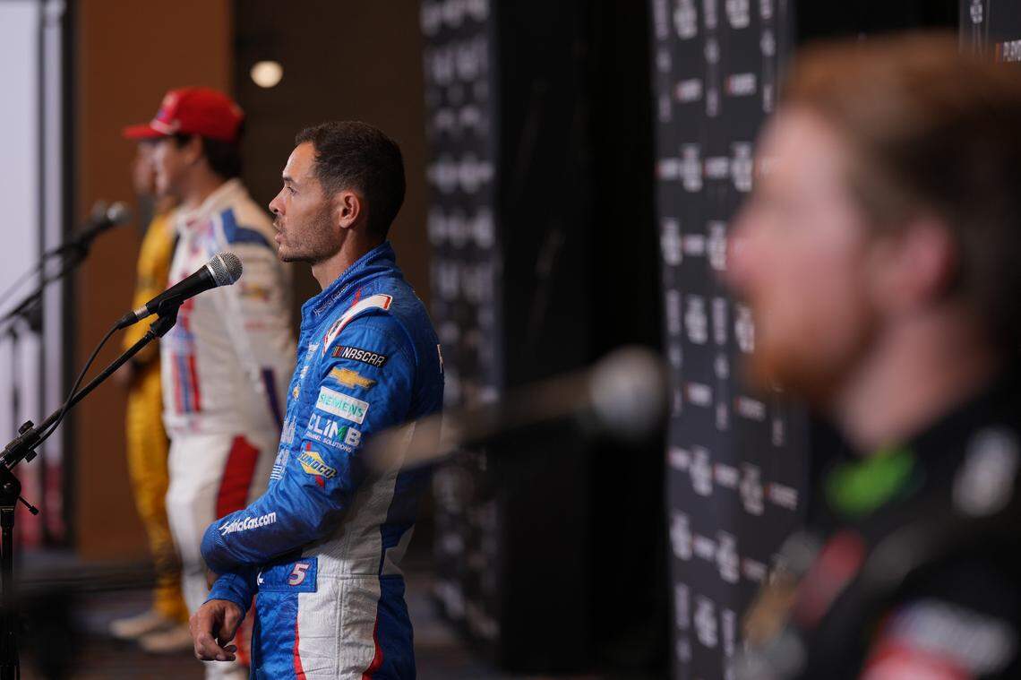 Sep 4, 2024; Charlotte, North Carolina, USA; Tyler Reddick, Kyle Larson, Harrison Burton and Christopher Bell speak to media members during the NASCAR Playoffs Media Day at the Charlotte Convention Center.