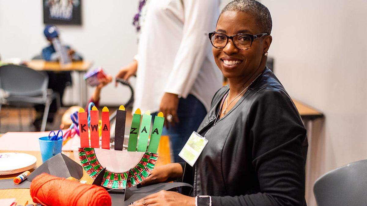 A volunteer prepares for Kwanzaa celebrations at the Harvey B. Gantt Center for African American Arts + Culture.