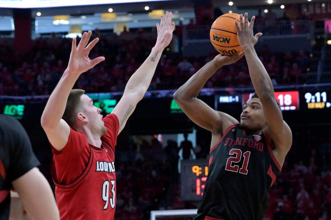 Mar 8, 2025; Louisville, Kentucky, USA; Stanford Cardinal guard Jaylen Blakes (21) shoots against Louisville Cardinals forward Noah Waterman (93) during the first half at KFC Yum! Center.