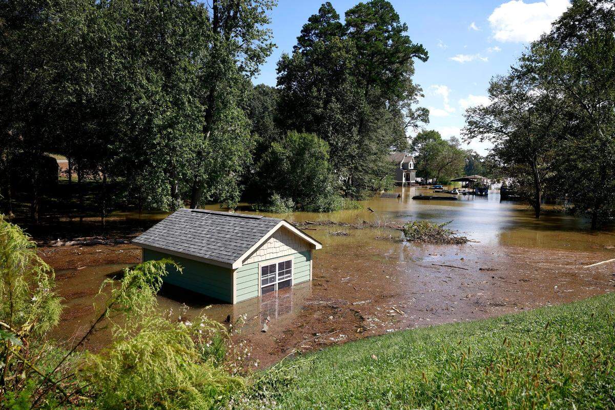 A small building is submerged in floodwater of the Catawba River on Riverside Drive on Saturday, September 28, 2024.