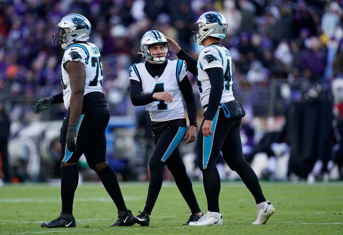 Carolina Panthers place kicker Eddy Pineiro (4) celebrates a field goal with teammate JJ Jansen (44) in the second half of an NFL football game Sunday, Nov. 20, 2022, in Baltimore. (AP Photo/Patrick Semansky)