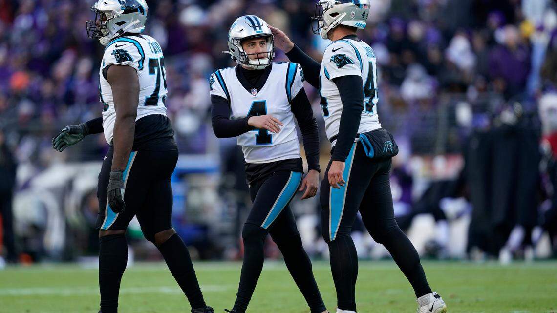 Carolina Panthers place kicker Eddy Pineiro (4) celebrates a field goal with teammate JJ Jansen (44) in the second half of an NFL football game Sunday, Nov. 20, 2022, in Baltimore. (AP Photo/Patrick Semansky)