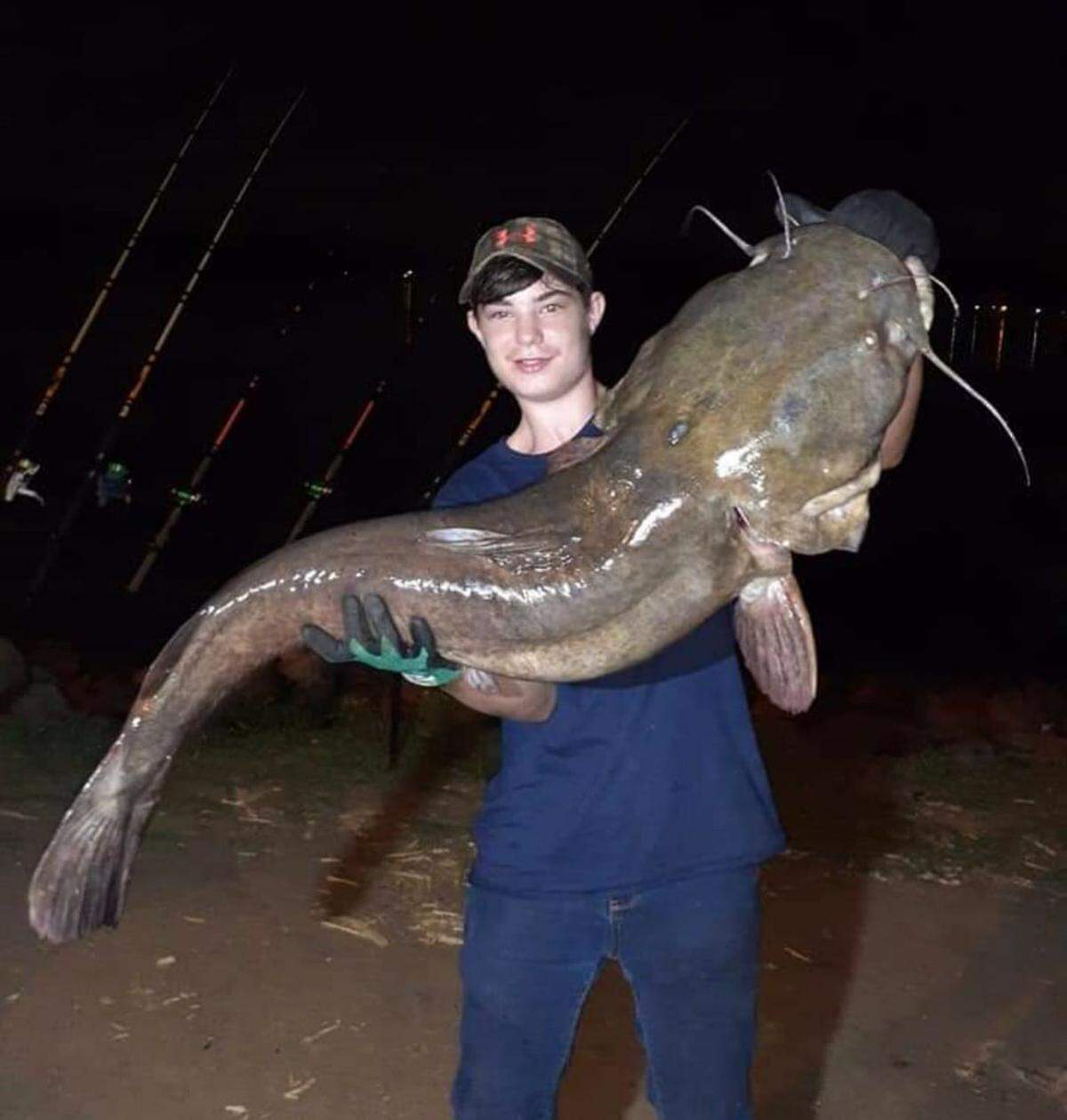 Landon Anthony, 13, of Clover, SC, poses with the monster catfish he caught on Lake Wylie while fishing at night with his pawpaw.