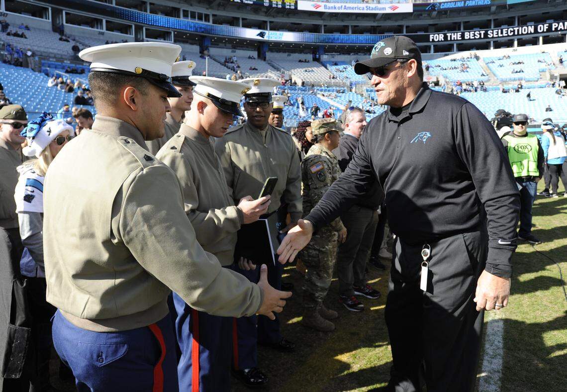 Carolina Panthers head coach Ron Rivera greets members of the military before Sunday’s 24-10 loss to the Atlanta Falcons in Charlotte.
