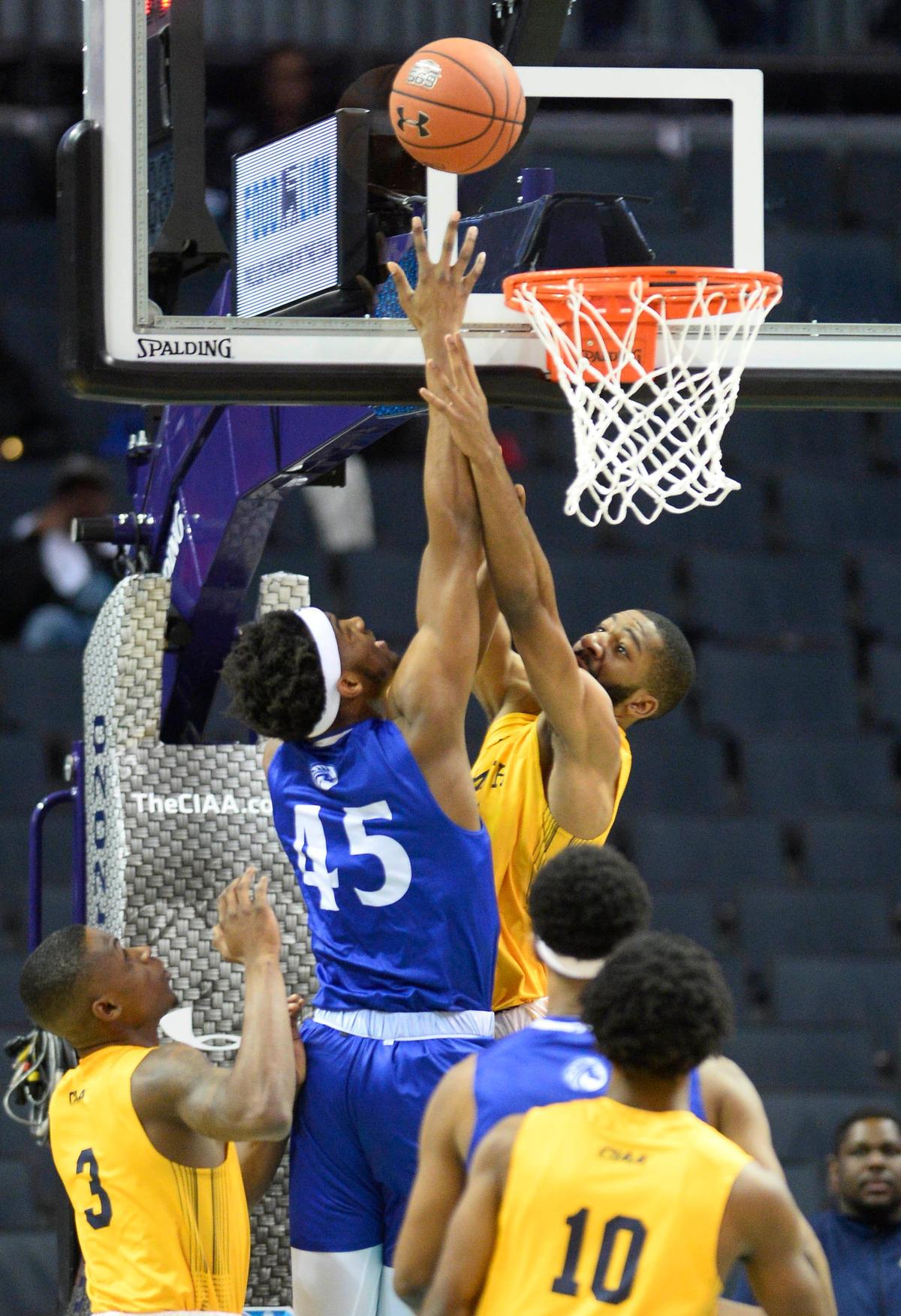 Fayetteville State’s Will Brown (45) goes up against Johnson C. Smith’s Austin Nelson (21) during he first half of their semifinal game in the 2020 CIAA Tournament at the Spectrum Center on Friday, February 28, 2020.