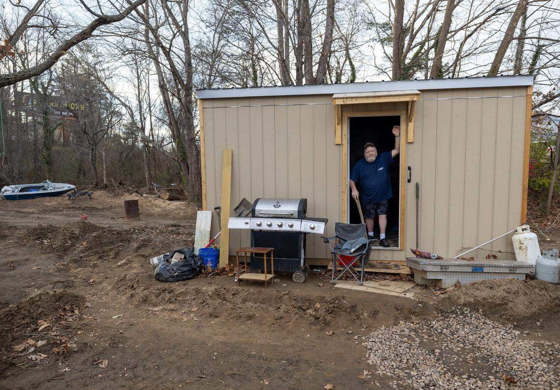 Thomas Whiteside, photographed in November 2024, is among the people who have received temporary housing from Cabins 4 Christ. This shelter was placed by his home in Black Mountain.