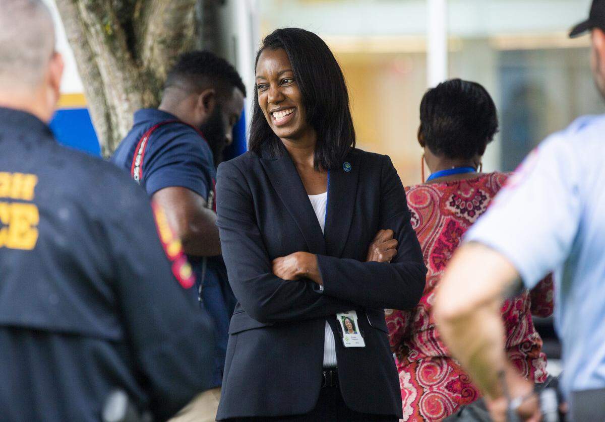 As Raleigh's new police chief at the time, Estella Patterson visits with officers during a National Night Out event at Midtown Park in North Hills, on Aug. 3, 2021, in Raleigh.